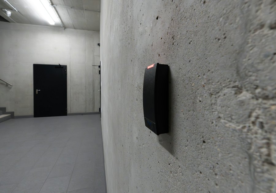Access control card reader beside a door